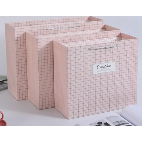 Excellent quality Luxury embossed gift dress packaging paper bags with custom handle paper bags --XP2286