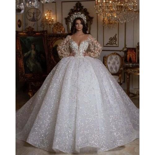 Luxury Wedding Dresses Illusion O Neck Beaded Lace Long Sleeve Ball Gown Puffy Bridal Gown 2022