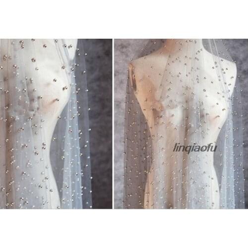 Three-dimensional encryption handmade pearl beaded perspective mesh fabric dress High-end wedding dress fabric