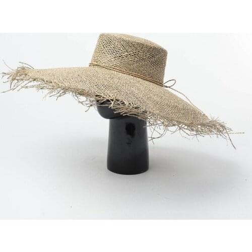 New hand-woven large-edged flat-topped seagrass straw hat in spring and summer Europe and America beach hat sun hat adjustable