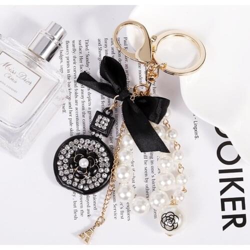 Crystal Bottle Keychain Pearl Pendant Luxury Jewelry Bowknot Pearl Chian Camellia Keychains For Woman Bag Decoration