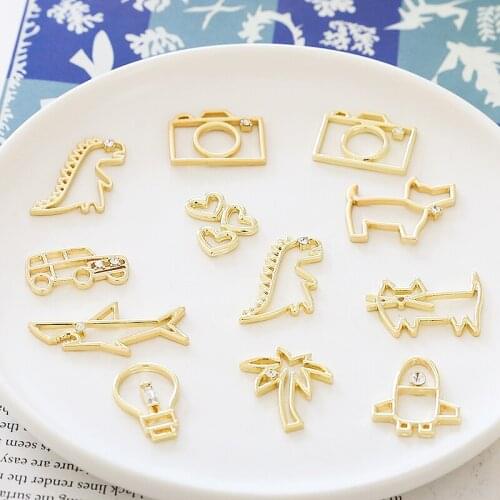 10pcs Simple hollow animal dinosaur Statement Earrings Trendy car tree rocket bulb Rhinestone pendant diy jewelry accessories