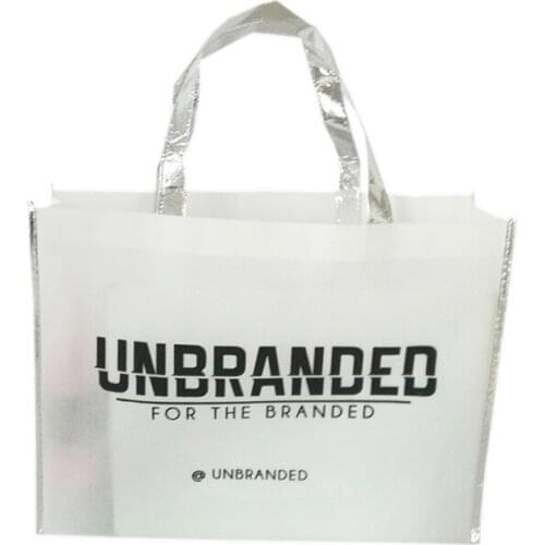 Wholesale 500pcs/lot Premium Recycled White Non Woven Bag with Silver Edges and Handle for Promotion Clothing Store Daily Use