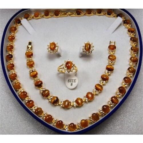 Womens temperament fashion metal gold-plated egg shaped Tiger Eye Stone Necklace + Bracelet + earring + Ring Set