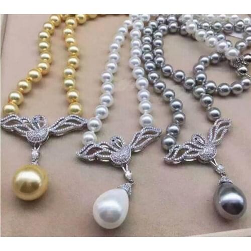 Silver plated swan connector/pendant 10mm Shell pearl necklace 18"