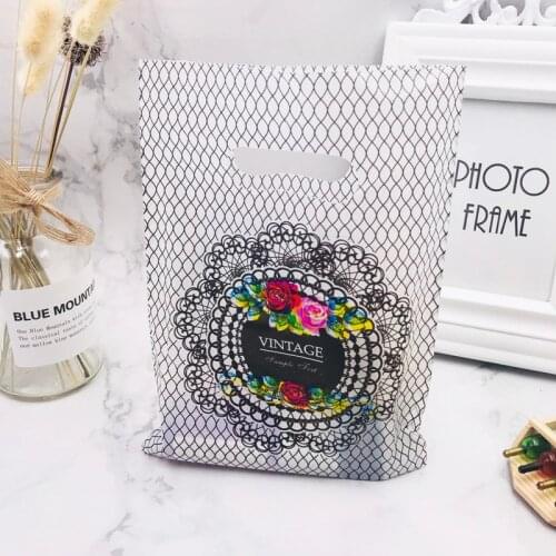 100pcs/lot 15*20cm Grid Flower Design Plastic Gift Bags Favor Jewelry Boutique Gift Packaging Plastic Shopping Bag With Handle