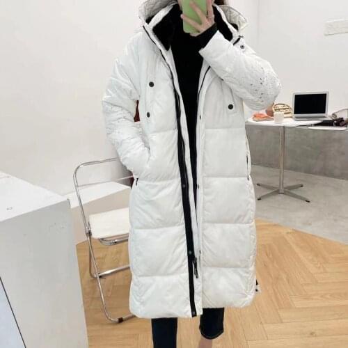 New womens white medium length thickened warm cotton coat in winter in Spain
