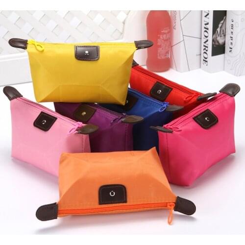 Korean version of cute dumpling makeup bag candy color folding dumpling bag ingot type storage wash bag wholesale