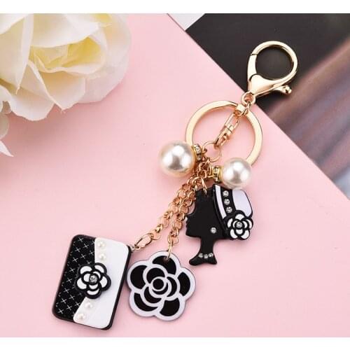 New PU Leather Key Chains Bag Alloy Keychain Black and White Camellia Rose Tassel Pendant Ornaments Gifts for Women