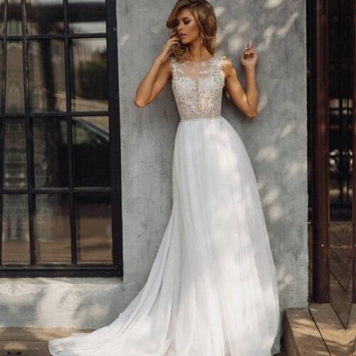 Sleeveless A Line Wedding Dresses 2021 Appliques O Neck Bridal Gown Wedding Gowns Floor Length Backless Vestido de Noiva