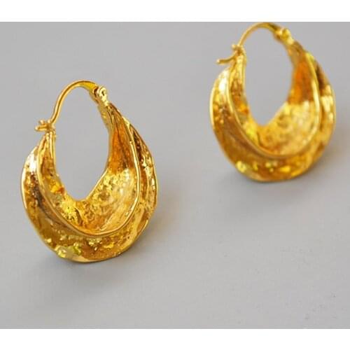 French retro-atmospheric hand-hammering brass atmospheric revolving wave basket Earrings