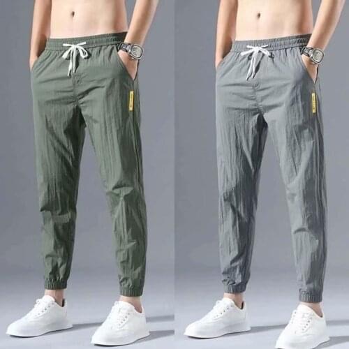 Summer ice silk mens casual pants summer nine-point self-cultivation Korean version of the trend of sports pants