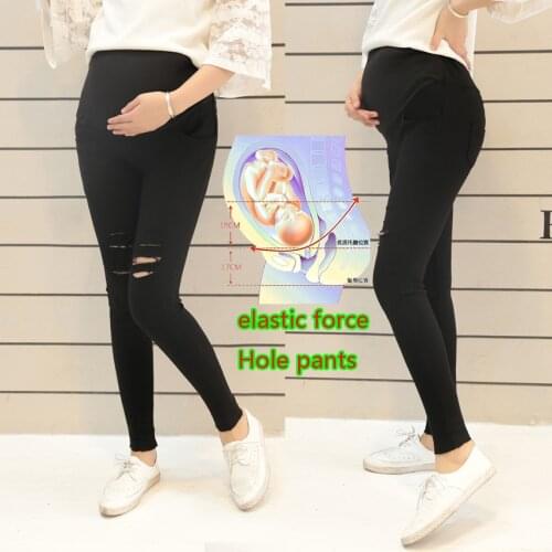 Spring and autumn new maternity pants pregnant women wash water denim hole pants stretch stomach lift pants feet pants