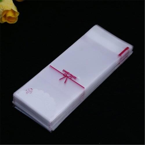 100PCS Bowknot Whhite plastic cookie packaging 5x10cm wrapper bags opp self adhesive bags gift bag Lipstick package