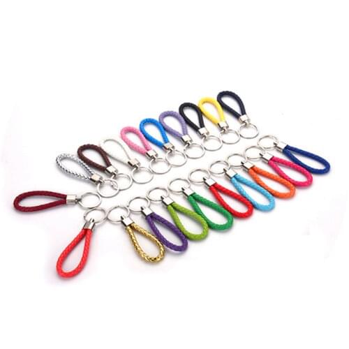 Hand-knitted couple leather rope keychain creative handmade leather woven jewelry pendant