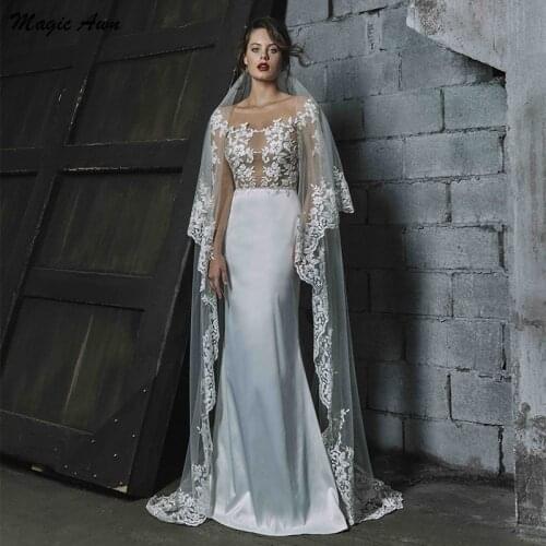 Magic Awn Long Sleeve Mermaid Wedding Dresses Beach Lace Appliques Illusion Princess Wedding Party Gowns Bodice Backless Vestido