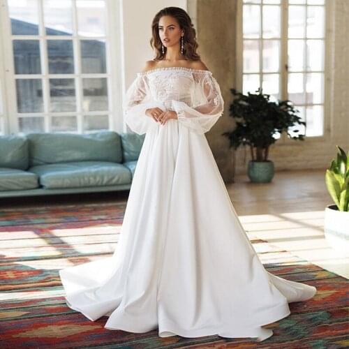 Exquisite Off the Shoulder Beading Beach Wedding Dresses Long Puff Sleeves Princess Bride Dresses A-Line Tulle Bridal Gowns 2021