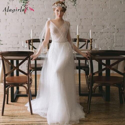 Pearls beading Illusion vestidos de noiva 2020 Princess v-neck sleeveless wrap dress Exquisite pearls button back robes