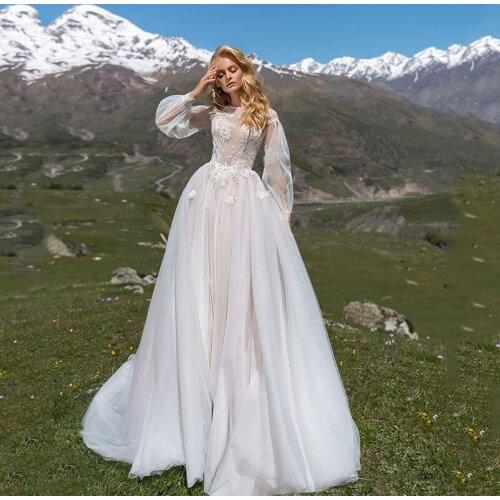 Hot Sale Graceful A Line Long Sleeves Bridal Wedding Dresses Jewel Neck Appliqued Buttons Back Wedding Gowns for Bride 2021