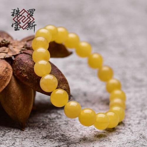 Optimized amber, honey, wax, round bead, single circle hand string, white flower, gold, honey twisted couple Bracelet