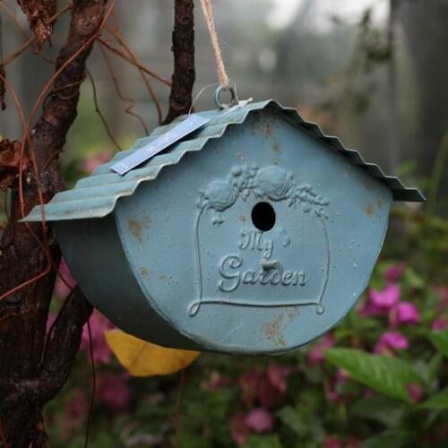 Blue retro antique metal birdhouse for decor