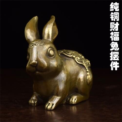 Copper lucky fortune rabbit on a map of small antique old pure brass casting yellow rabbit Zodiac