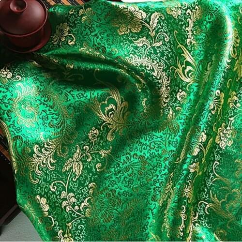 High quality brocade jacquard polyester green background golden Phoenix Tail fabric for patchwork tissue women dress 6 meters