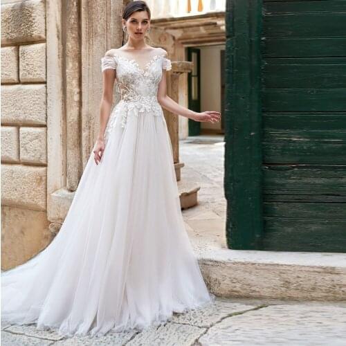 2021 Off Shoulder Short Sleeve Wedding Dresses Appliques A Line France Bridal Gowns No Train Sexy Charming Robe