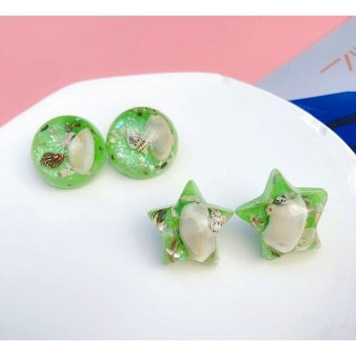 And the geometric stars round shells tycoon temperament stud earrings sea wind exaggerated green needles stud earrings
