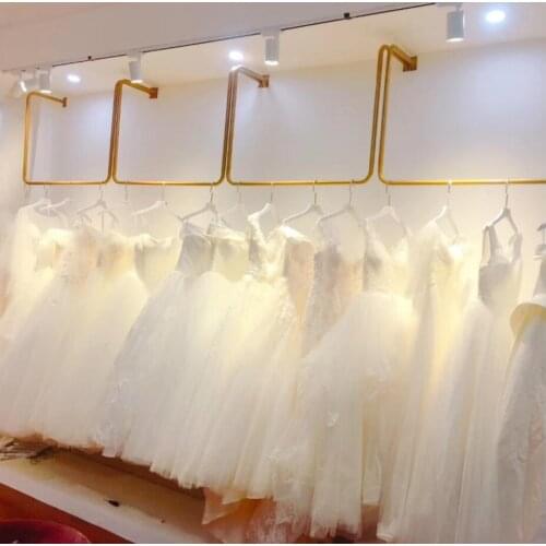 Upper wall gold wedding dress shelf wall hanging mens and womens clothing rack ceiling clothing store hanger