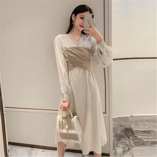 Long sleeve dress female 2020 Korean spring new fashion temperament V-neck long fake two-piece stitching dress