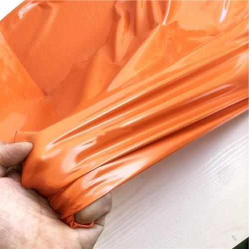 140cm*100cm Orange bright reflective mirror PU leather fabric four-sided stretch knitted bottom imitation leather fabric