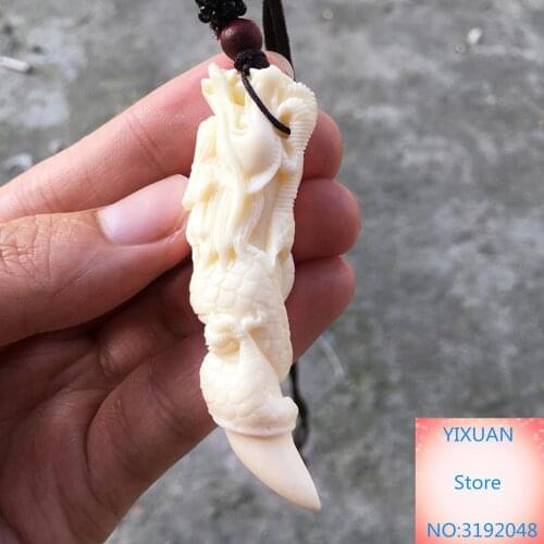 Colgante con forma de diente de dragón de fruta de marfil, diente de perro de mamut, diente de Lobo, hueso afilado, collar talla