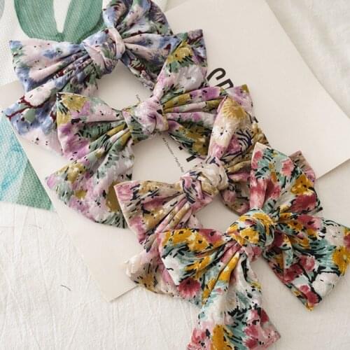 Japanese and Korean version flower breaking big bow hairpin fashion style female sweet versatile spring clip headdress Spring