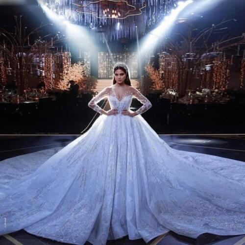 Luxury Wedding Dresses 2021 Sheer Neck Illusion Long Sleeves Sequined Beaded Lace Bridal Gowns Saudi Arabia Vestido De Novia