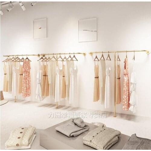 Clothing store display rack womens wear wall childrens wear wall hanging golden clothes hanger floor shelf clothes