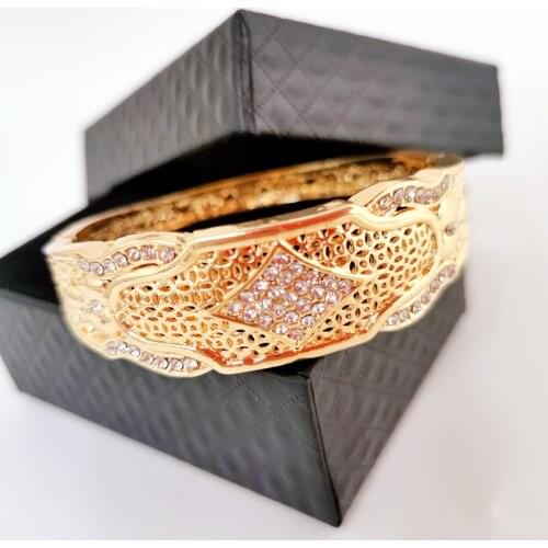 Moroccan women wedding charm gold bracelet is embossed with a complicated but not messy elegant pattern