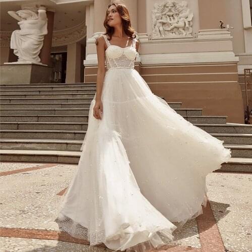 Luxury Pearls Floor Length Bridal Ball Gown 2021 New Arrival Spaghetti Straps A Line Tulle Summer Beach Wedding Dress 2021