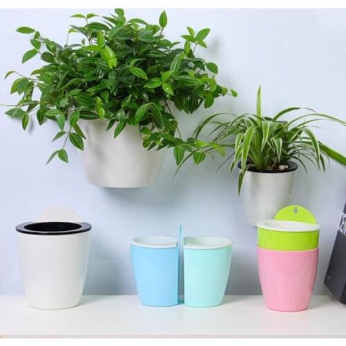 2019 New Self Watering Plant Flower Pot Wall Hanging Round Resin Plastic Planter Basket Garden Supply Home Garden with Hooks