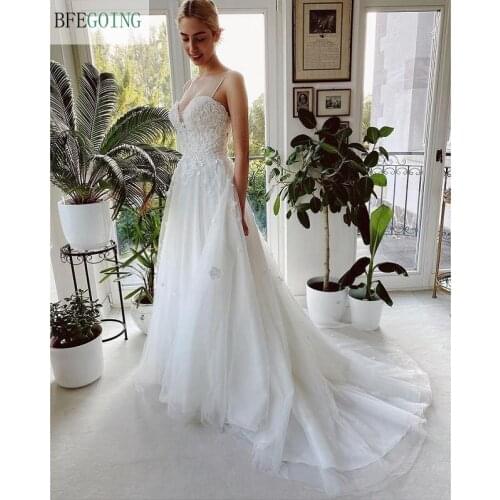 Ivory Lace Beading V-Neck Spaghetti Straps Floor-Length A-Line Wedding Dresses Chapel Train Bridal Gowns