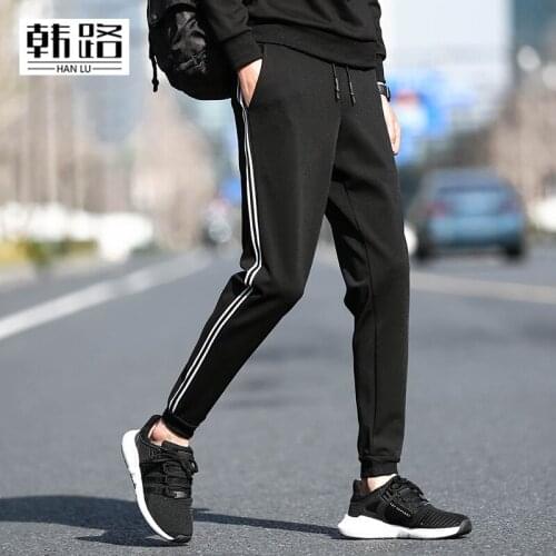 New mens Casual Hit color pants Spring autumn mens White stripe design Loose Sweatpants male black blue Beam foot trousers 4XL