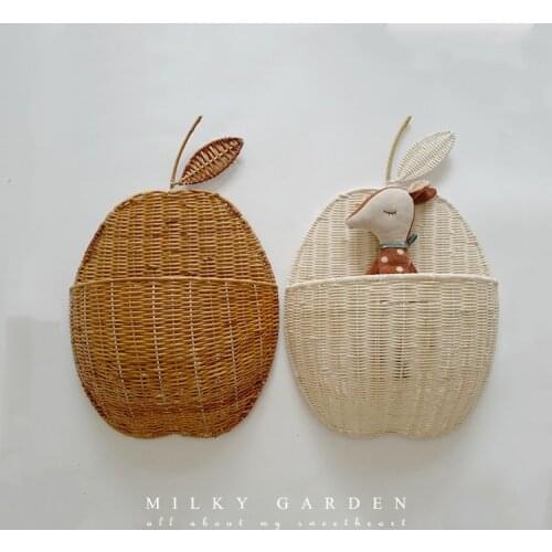 Handmade natural cane makes up wall to hang apple receives basket pear receives basket wall buys content basket