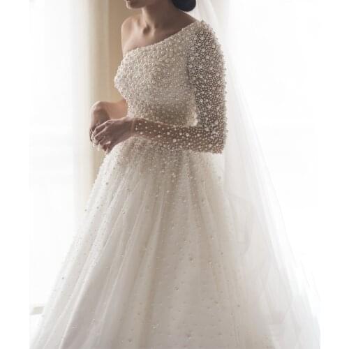 One Shoulder Long Sleeves Heavy Crystals Pearls Bling Bling Wedding Dress Luxurious Beading Iovry Bridal Gowns