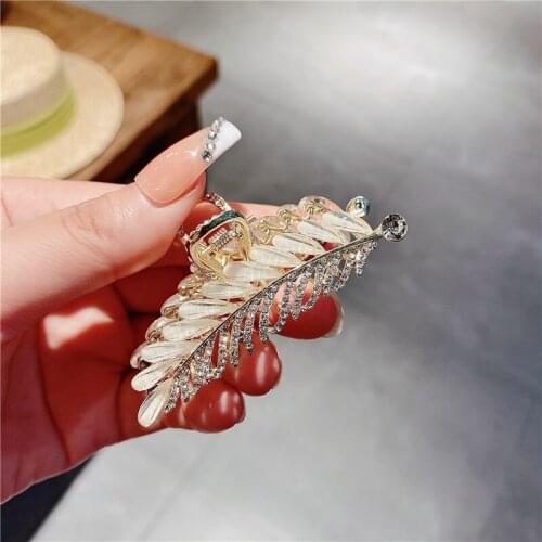 Korean fashion crystal feather metal texture grasping clip hairpin niche design sense French retro hairpin female