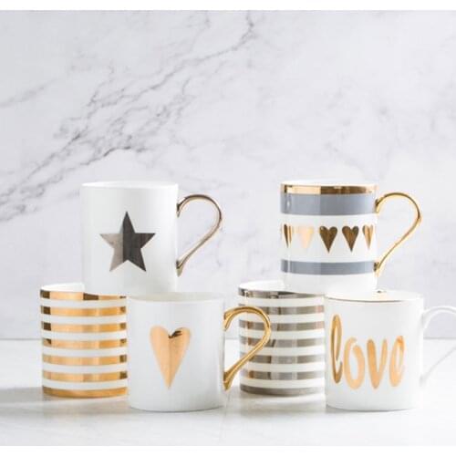 Design White Ceramic Coffee Mugs and Tea Cup with Mental Gold Handle, Glitter Heart, Star, Stripe Printing, Gift for Creativity
