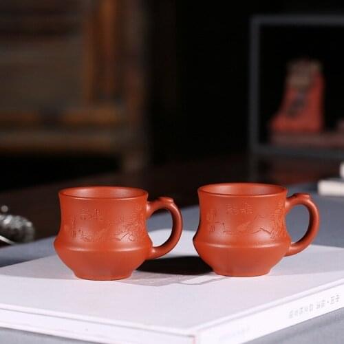 Small manufacturers selling custom tea cup yixing purple sand cup undressed ore mud zhu take cup by hand