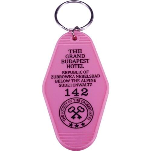 Wes Andersons Film "The Grand Budapest Hotel'' Inspired Pink Plastic Keytag M. Gustaves Famous Line Keychain