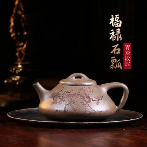 Hand-made with double-sided engraving. The Yixing Duan clay Kung Fu teapot has a small capacity of single lucky ladybug