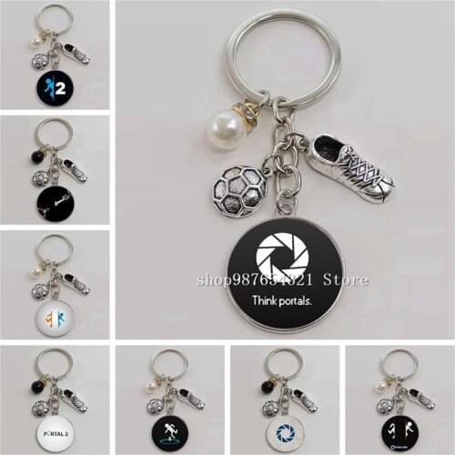 The new football sports picture transmission keychain, glass cabochon football shoes alloy pendant keychain