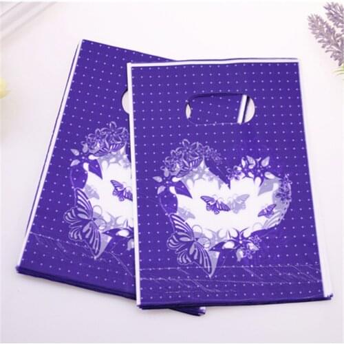 New Design Wholesale 100pcs/lot 15*20cm Luxury Plastic Wedding Candy Packaging Gift Bags With Lovely Heart
